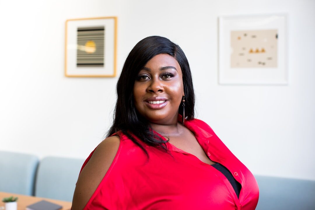 Portrait of a smiling woman in a bright office