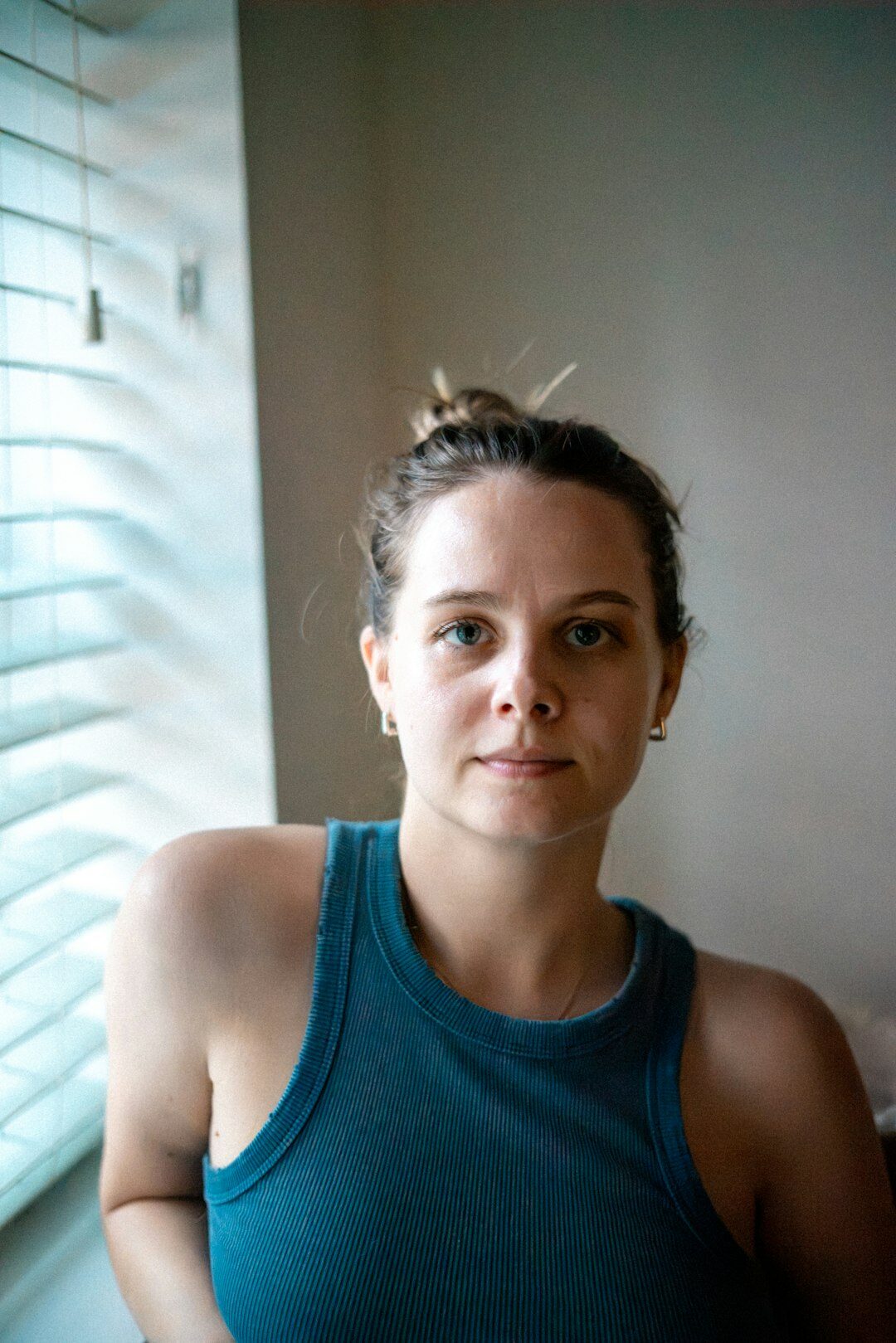 Portrait of a young woman near a window