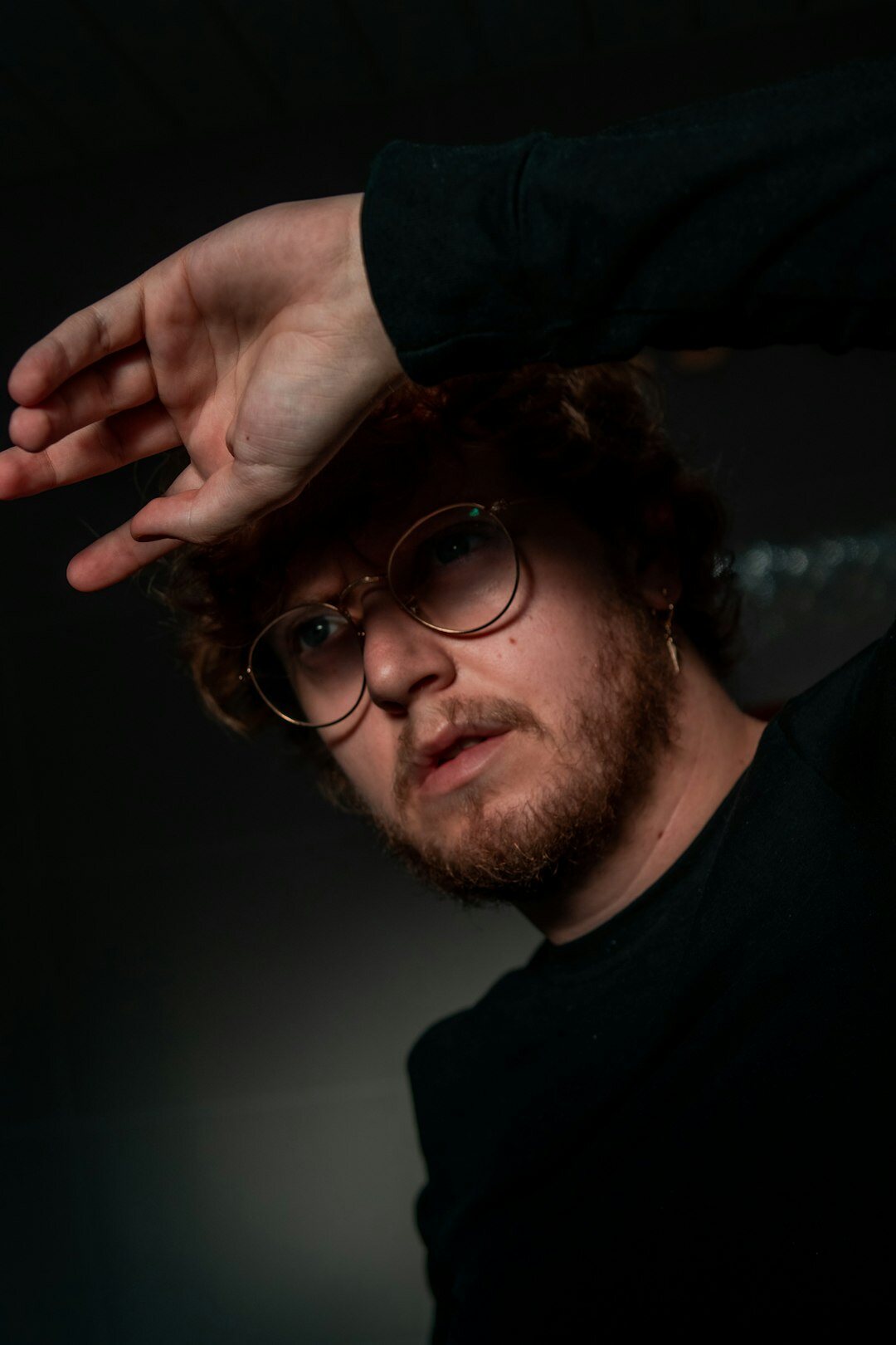 Studio portrait of a man with glasses and a beard