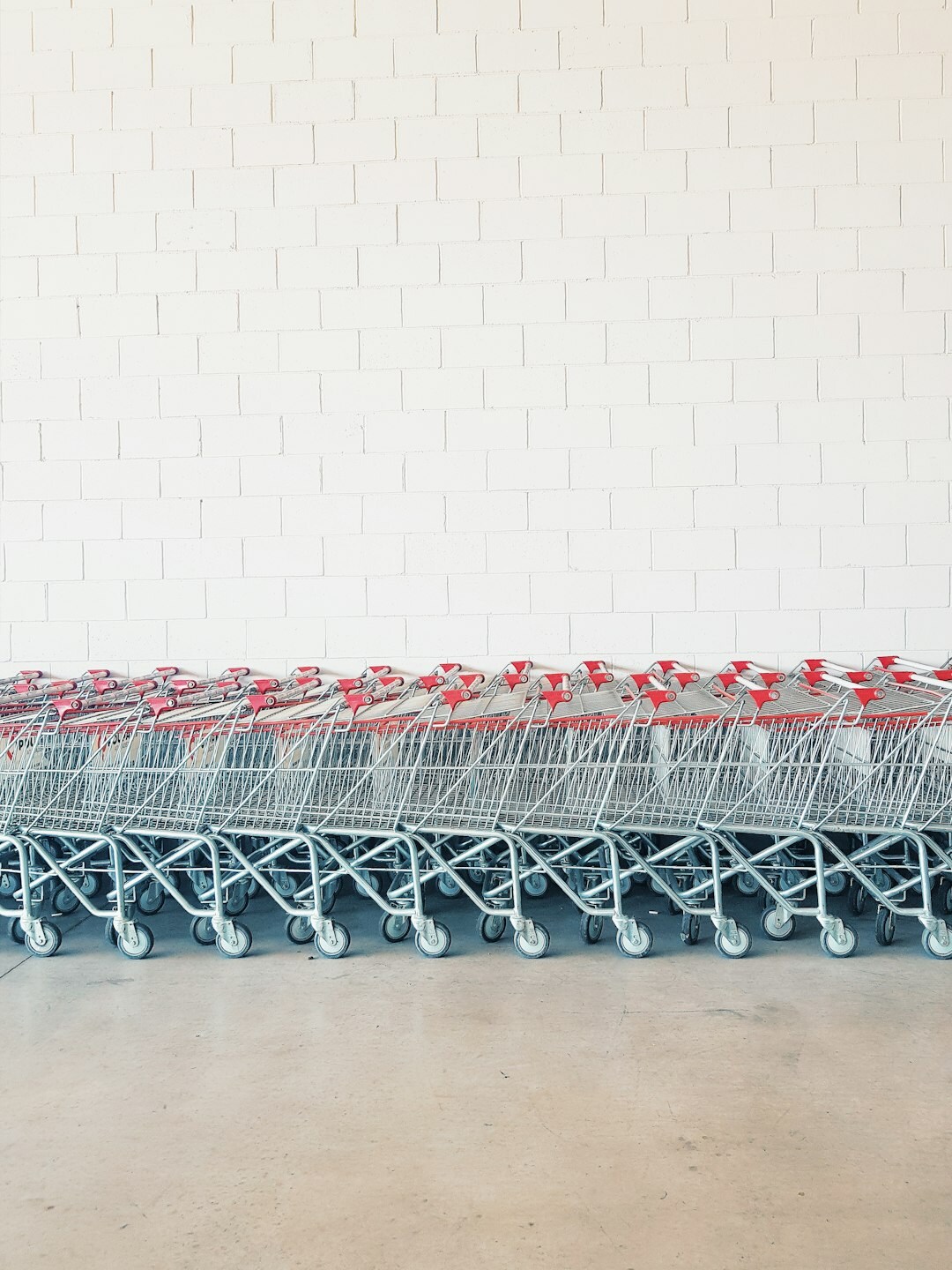 Shopping carts lined up outside a supermarket